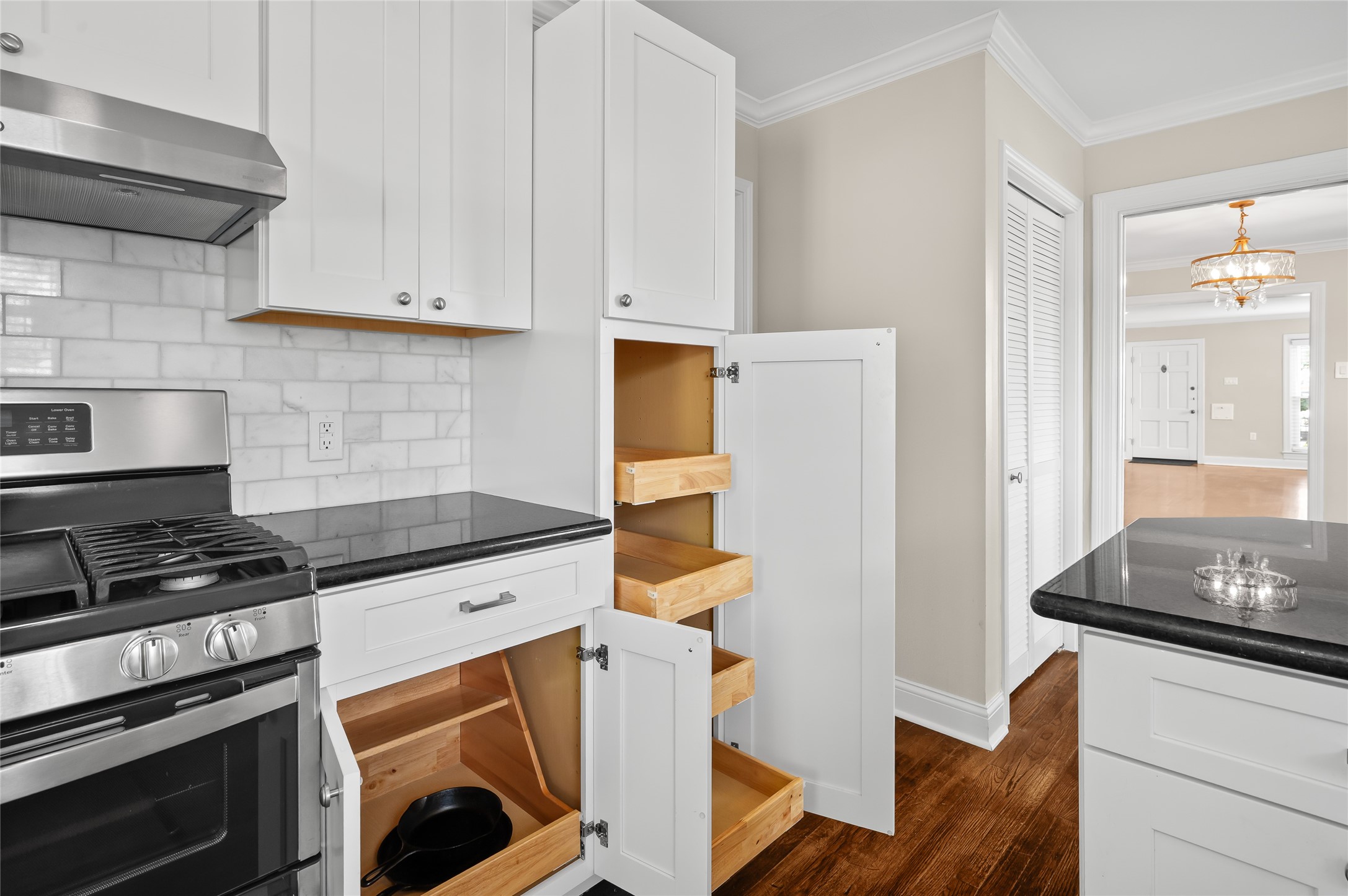 6673 Sylvan Road Houston, TX 77023 - Photo 11 of 39 a kitchen with granite countertop a stove and a refrigerator