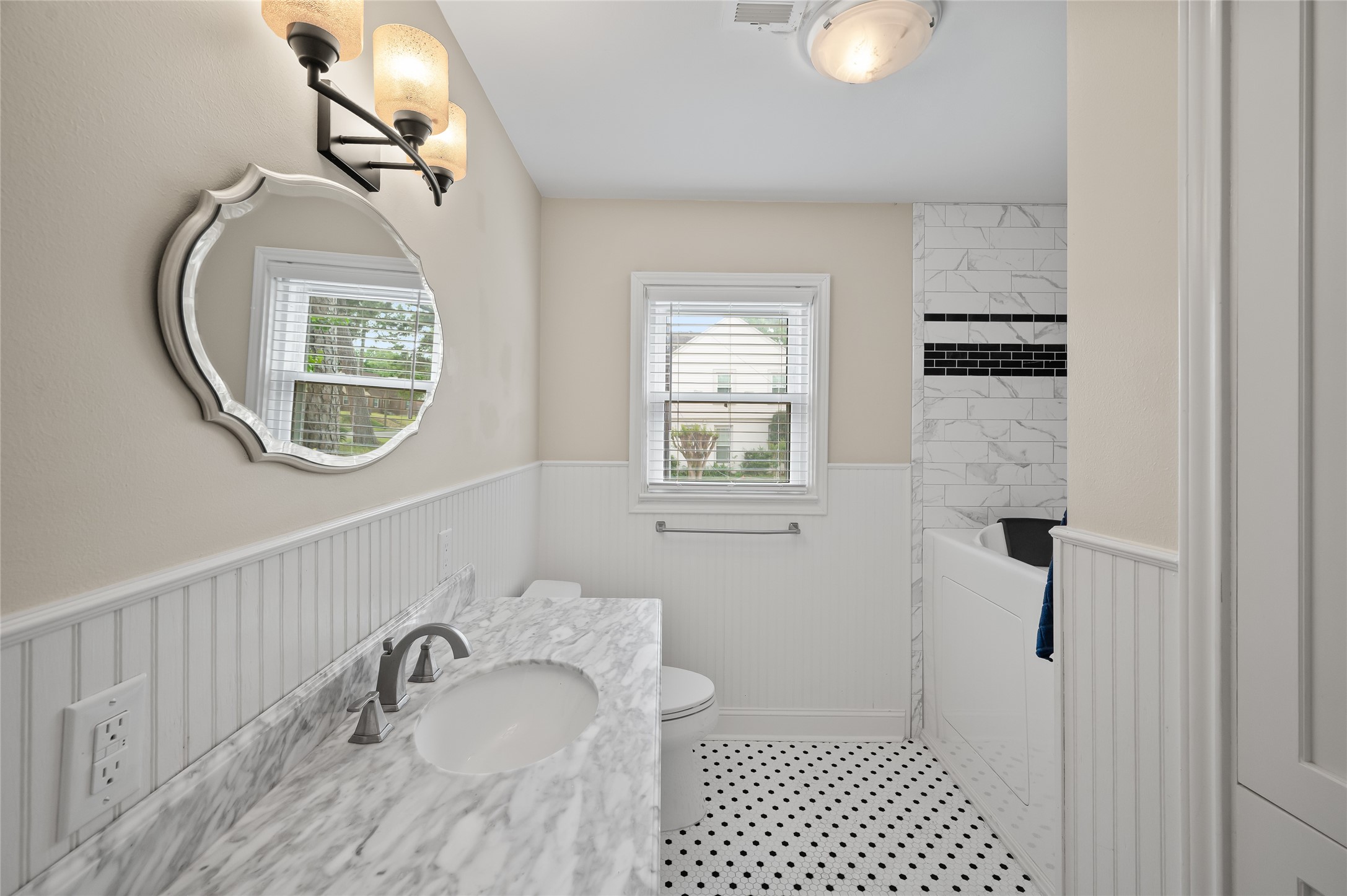 6673 Sylvan Road Houston, TX 77023 - Photo 19 of 39 a bathroom with a sink and a mirror