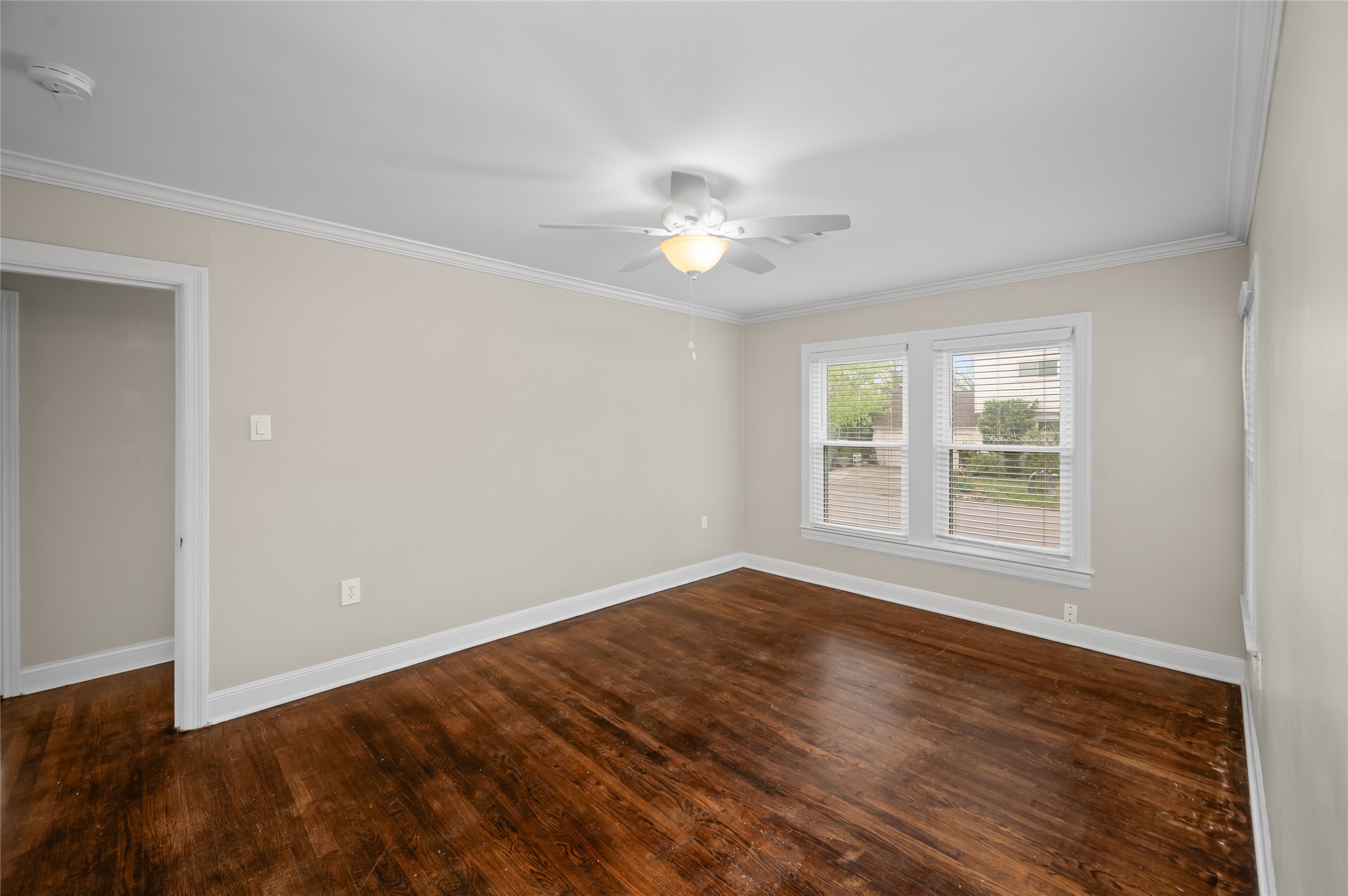 6673 Sylvan Road Houston, TX 77023 - Photo 20 of 39 wooden floor in an empty room with a window