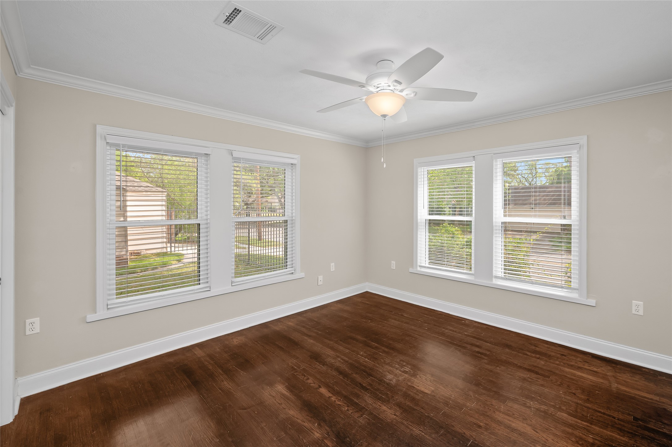 6673 Sylvan Road Houston, TX 77023 - Photo 24 of 39 a view of an empty room with wooden floor and a window