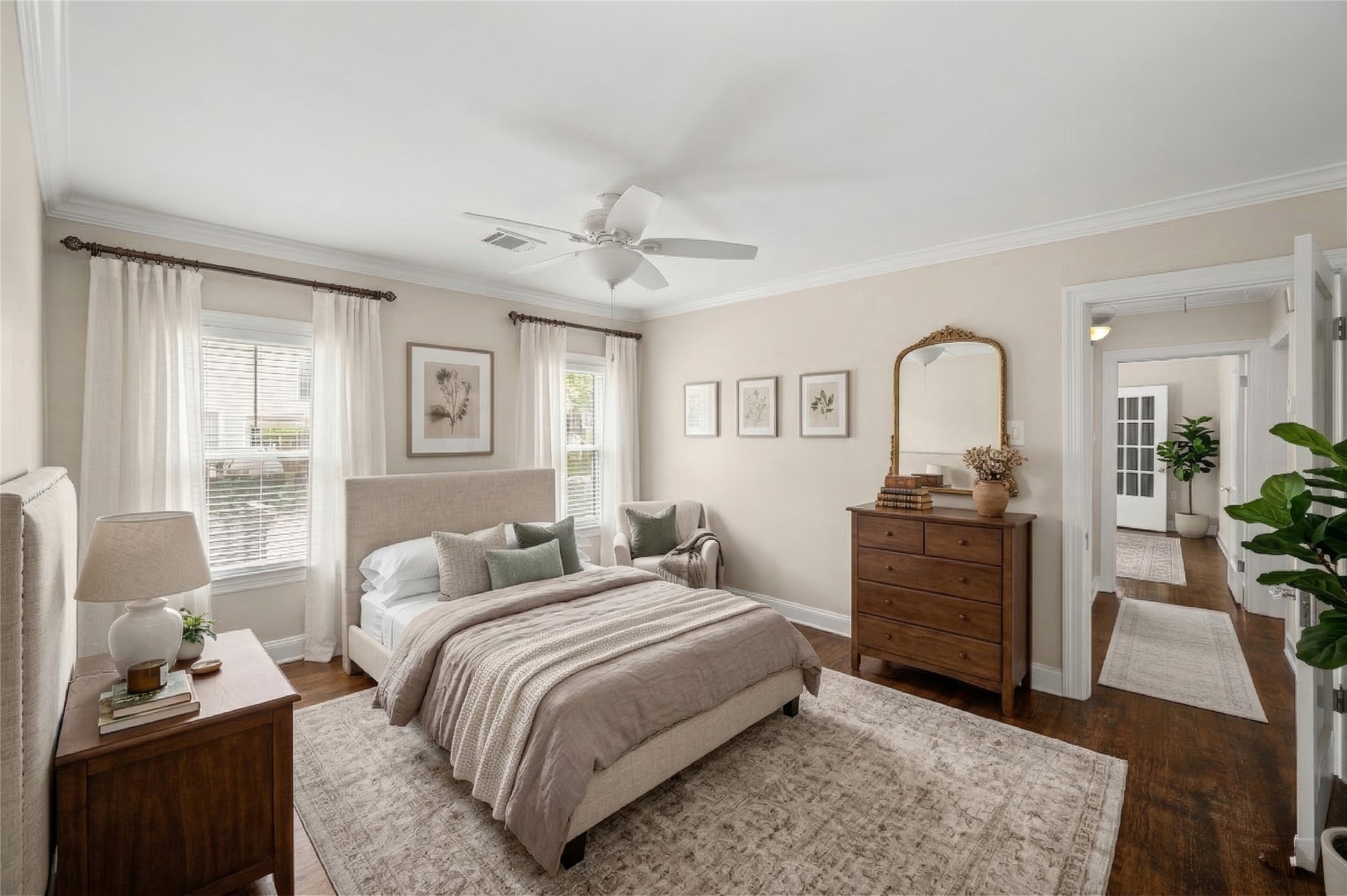 6673 Sylvan Road Houston, TX 77023 - Photo 25 of 39 a bedroom with a bed and wooden floor