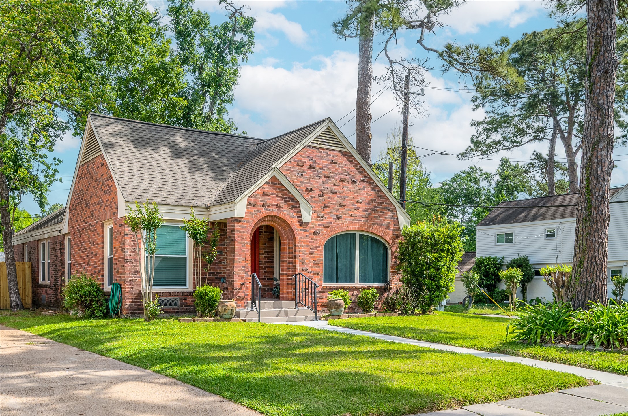 6673 Sylvan Road Houston, TX 77023 - Photo 3 of 39 a front view of a house with a yard