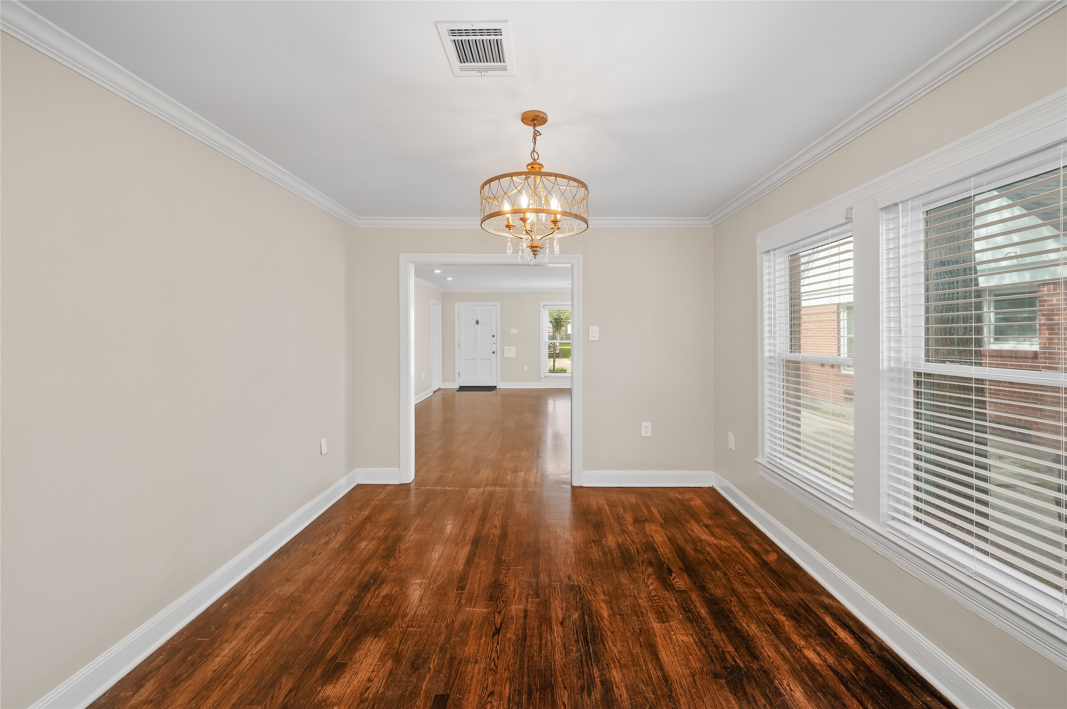 6673 Sylvan Road Houston, TX 77023 - Photo 7 of 39 a view of a room with wooden floor windows and entryway