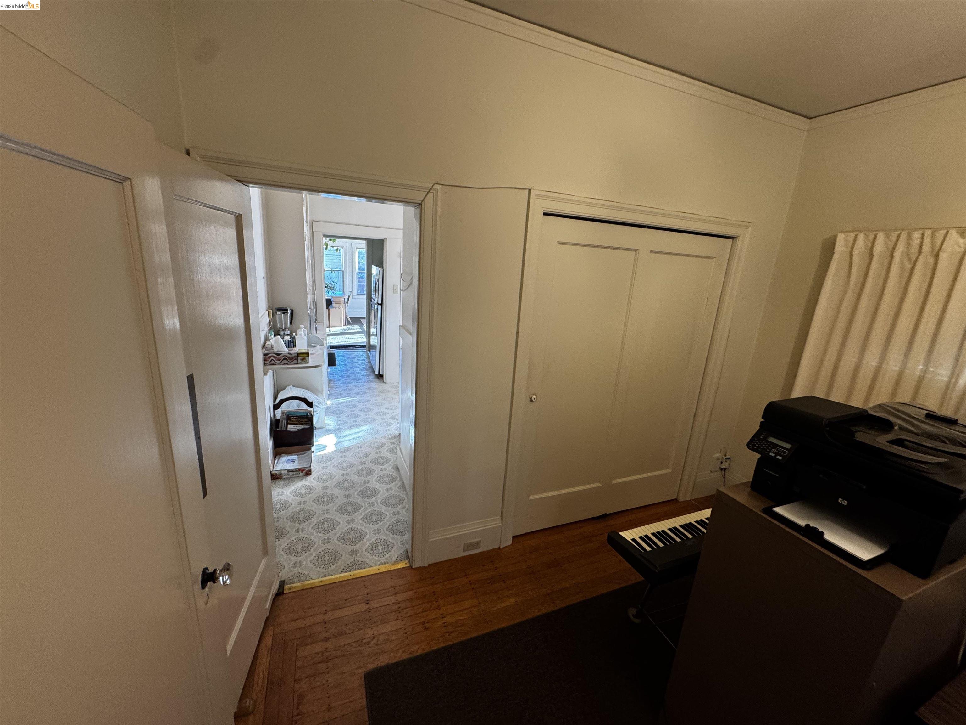 6100 Chabot Road Oakland, CA 94618 - Photo 12 of 28 Office with dark wood-style flooring and crown molding