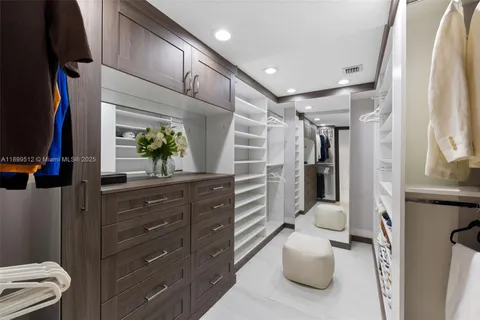 a kitchen with a stove and a view of living room