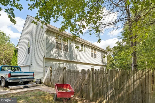 a backyard of a house with seating space