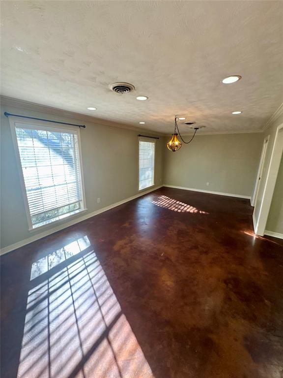 710 Robards Street Shreveport, LA 71105 - Photo 2 of 12 an empty room with wooden floor and windows
