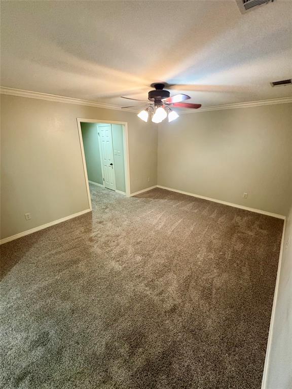 710 Robards Street Shreveport, LA 71105 - Photo 6 of 12 an empty room with a ceiling fan and a window