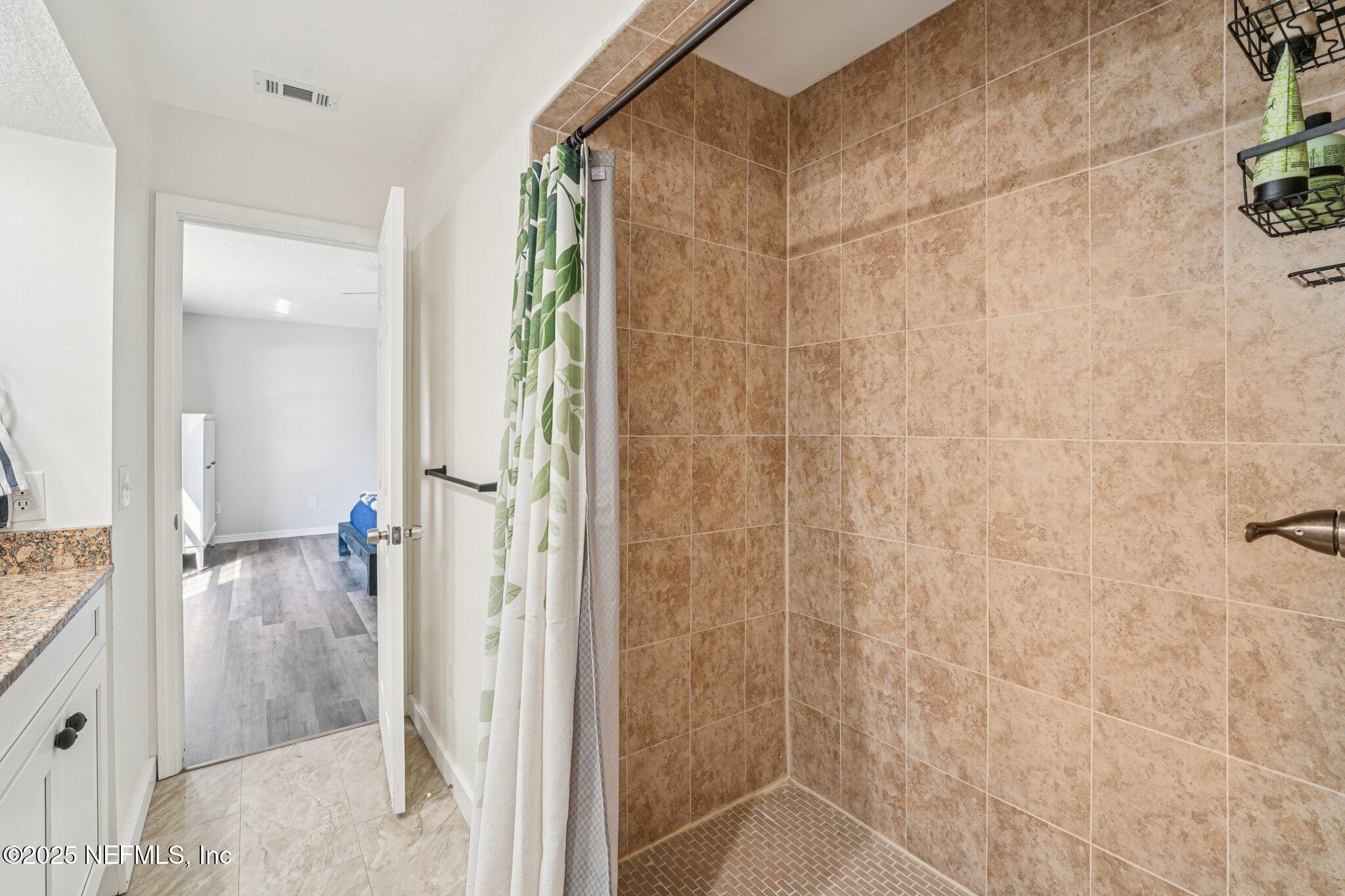 502 Royal Road St. Augustine, FL 32086 - Photo 18 of 34 a bathroom with a shower and a sink