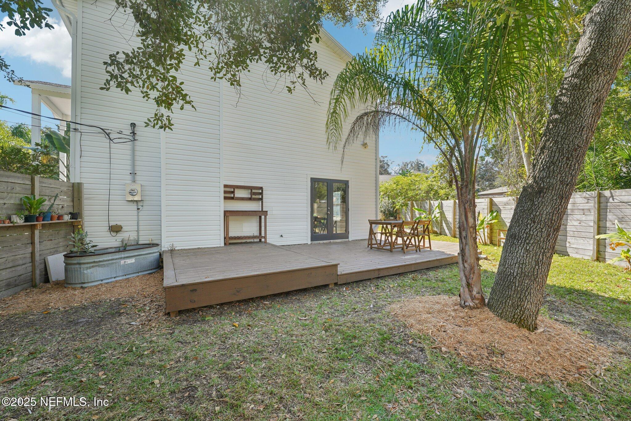 502 Royal Road St. Augustine, FL 32086 - Photo 29 of 34 a view of a house with large trees and a yard