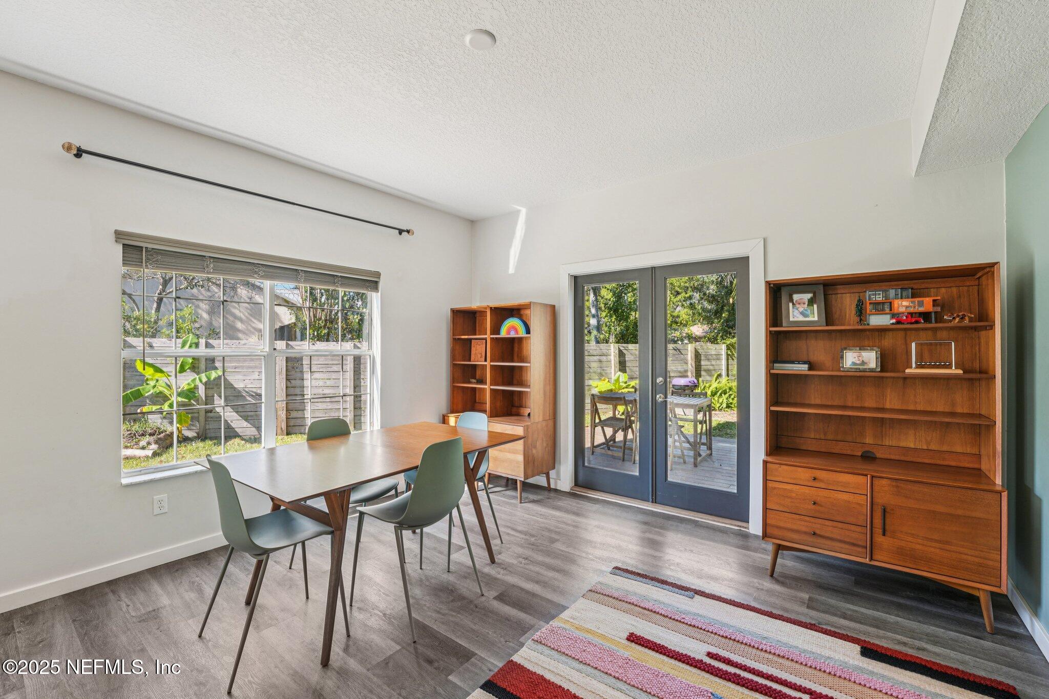 502 Royal Road St. Augustine, FL 32086 - Photo 7 of 34 a view of a dining room with furniture and wooden floor
