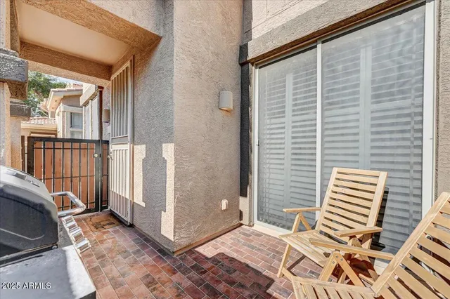 a view of a balcony with furniture
