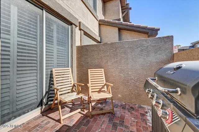 a view of a backyard with sitting area
