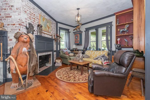 a workspace with furniture and painting on the wall