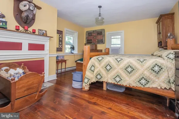 a room with lots of books and a large window
