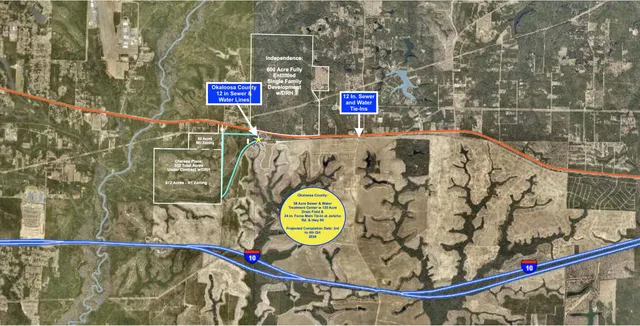 a street sign on a wall next to a road