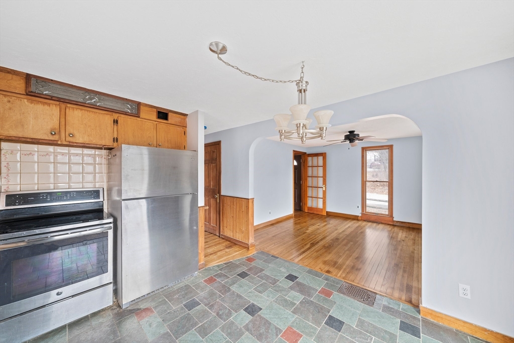 79 Pecksuot Road Weymouth, MA 02191 - Photo 16 of 42 a view of a kitchen with a sink and refrigerator