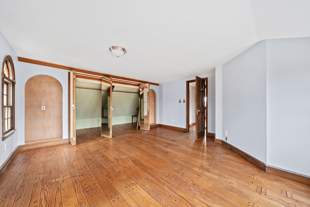 79 Pecksuot Road Weymouth, MA 02191 - Photo 18 of 42 a view of a room with wooden floor and a window