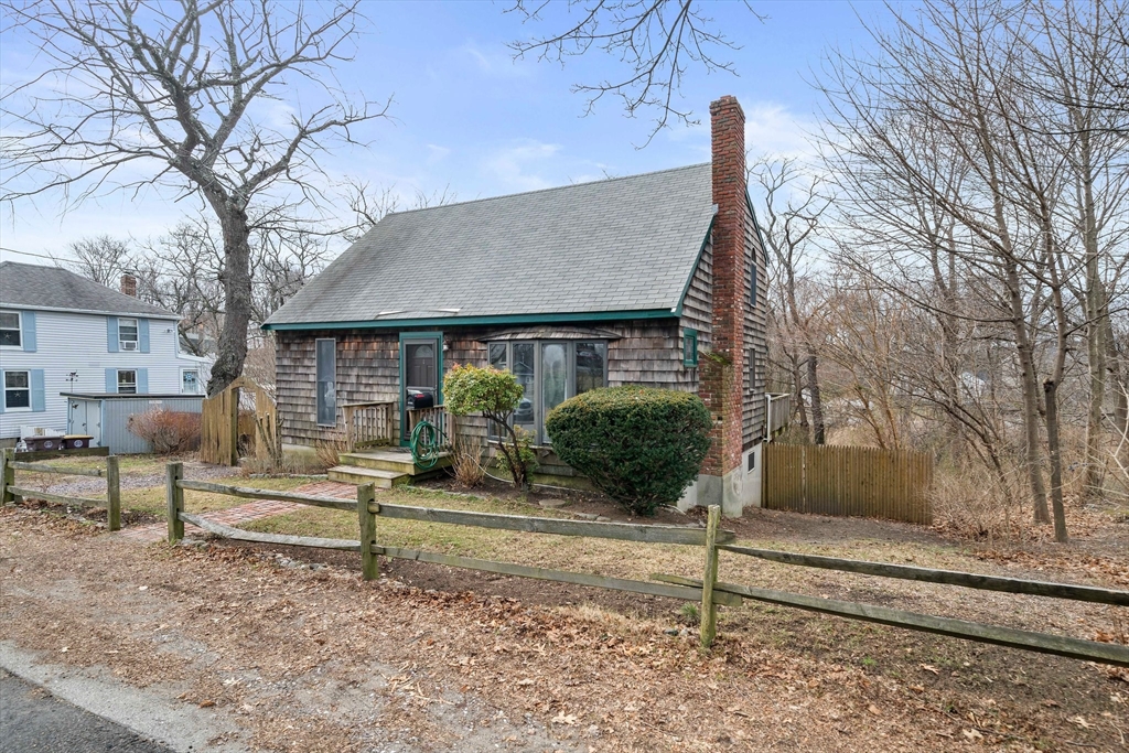 79 Pecksuot Road Weymouth, MA 02191 - Photo 3 of 42 a front view of a house with a yard