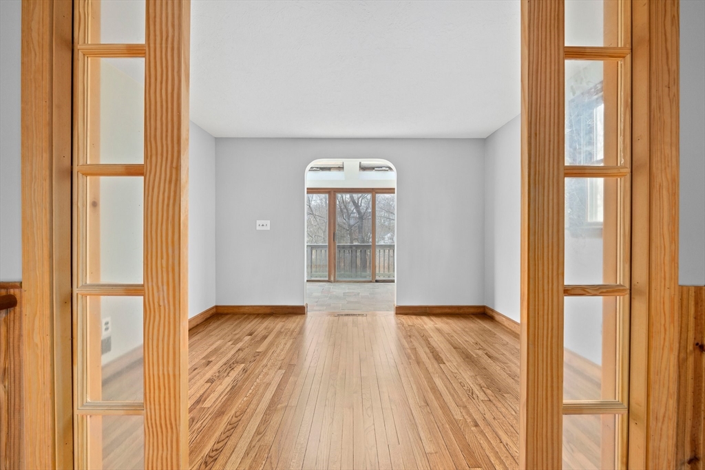 79 Pecksuot Road Weymouth, MA 02191 - Photo 7 of 42 a view of hallway with wooden floor and a window