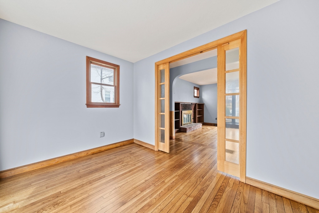 79 Pecksuot Road Weymouth, MA 02191 - Photo 9 of 42 a view of a room with wooden floor and a window