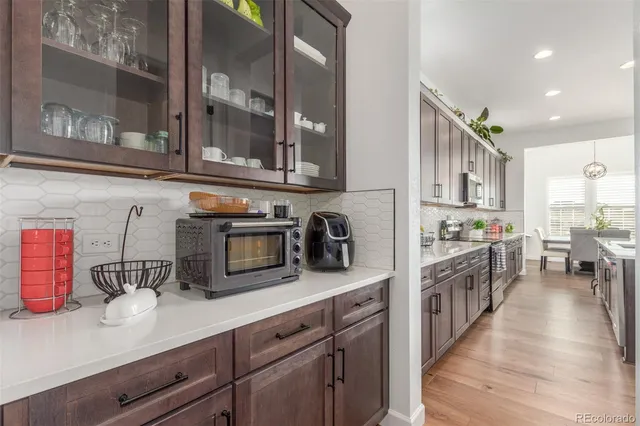 a bedroom with a bed and a flat tv screen on dresser