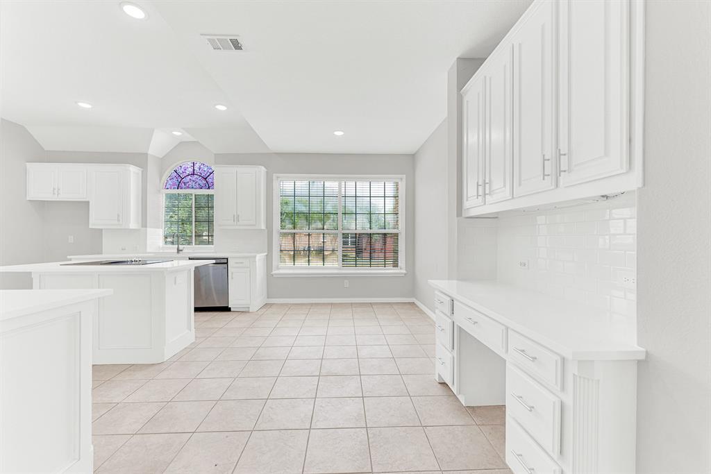3500 Neiman Road Plano, TX 75025 - Photo 14 of 26 This kitchen is next level with space and open sunshine! The breakfast nook has a large windowwith a window seat, plus a planning desk and additional storage.