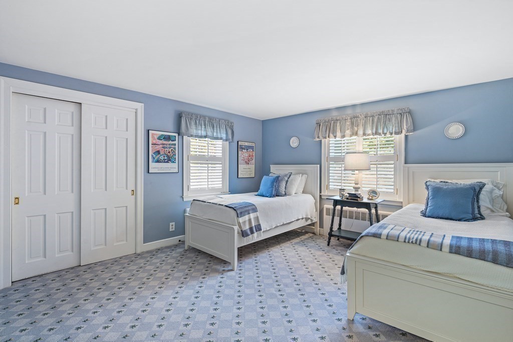 138 Hampshire Road Wellesley, MA 02481 - Photo 17 of 25 a bedroom with a bed and window