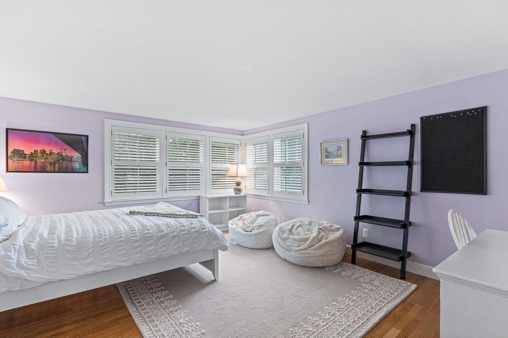 138 Hampshire Road Wellesley, MA 02481 - Photo 18 of 25 a spacious bedroom with a bed and glass window