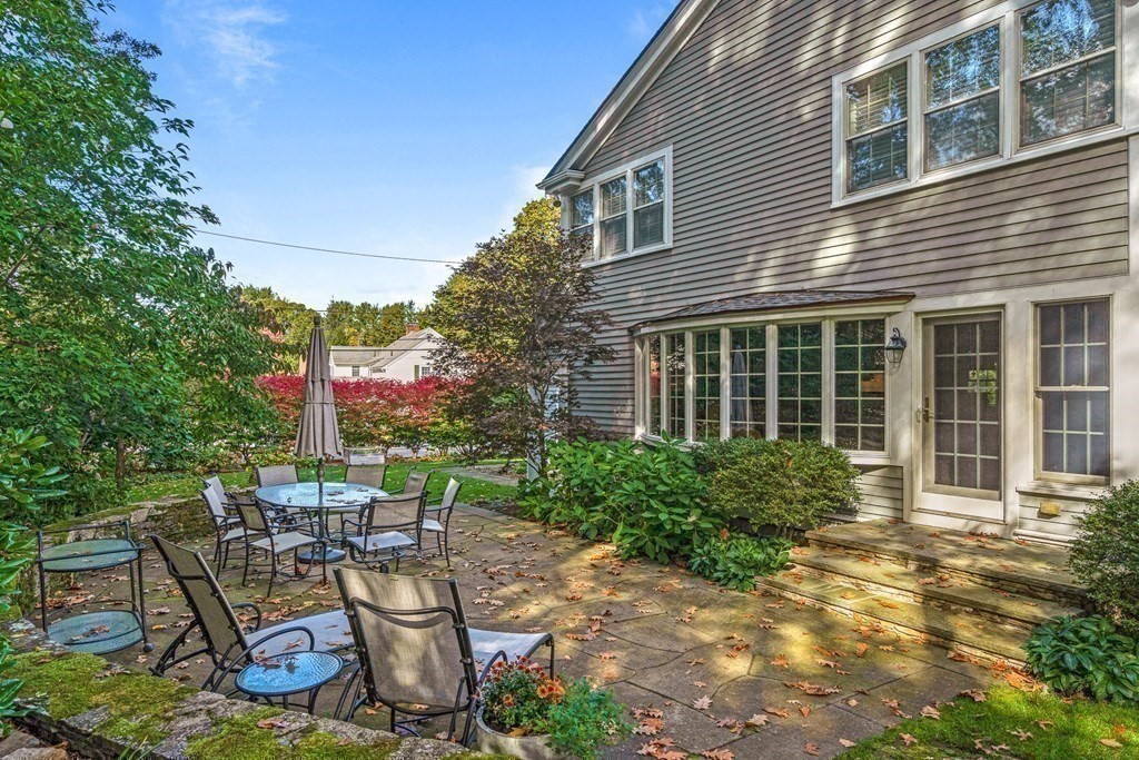 138 Hampshire Road Wellesley, MA 02481 - Photo 24 of 25 a view of a house with backyard sitting area and garden