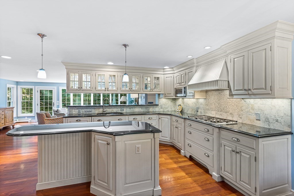 138 Hampshire Road Wellesley, MA 02481 - Photo 7 of 25 a kitchen with granite countertop a sink and cabinets