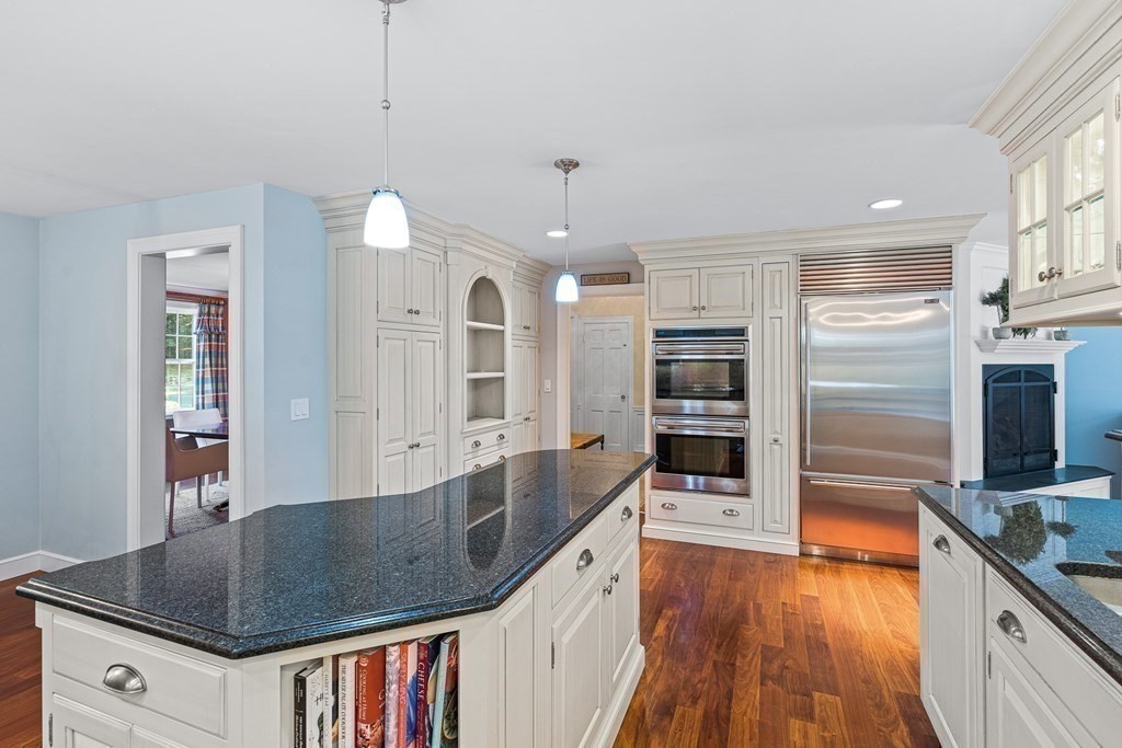 138 Hampshire Road Wellesley, MA 02481 - Photo 8 of 25 a kitchen with stainless steel appliances granite countertop a sink counter space cabinets and wooden floor