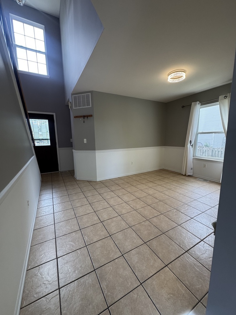 1716 William Drive Romeoville, IL 60446 - Photo 4 of 18 an empty room with windows