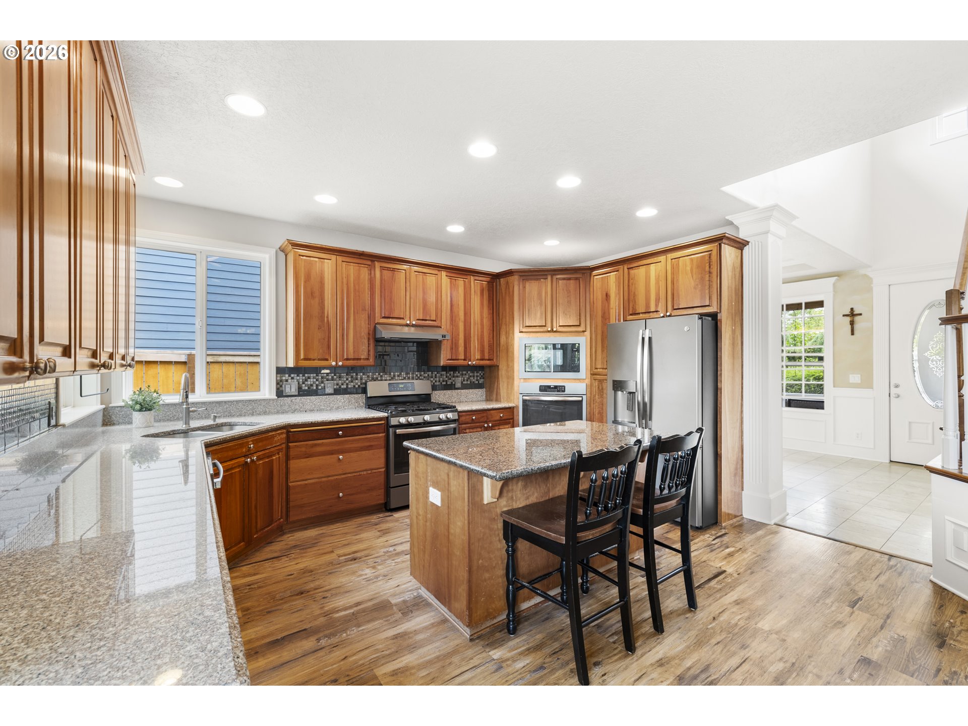 535 Maple Street Mount Angel, OR 97362 - Photo 12 of 48 a kitchen with stainless steel appliances granite countertop table chairs sink and cabinets