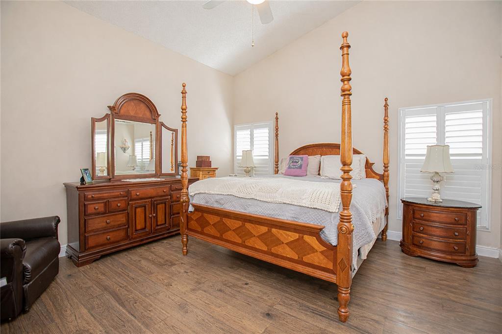 3321 Furlong Way Gotha, FL 34734 - Photo 13 of 26 a bedroom with a bed and a dresser