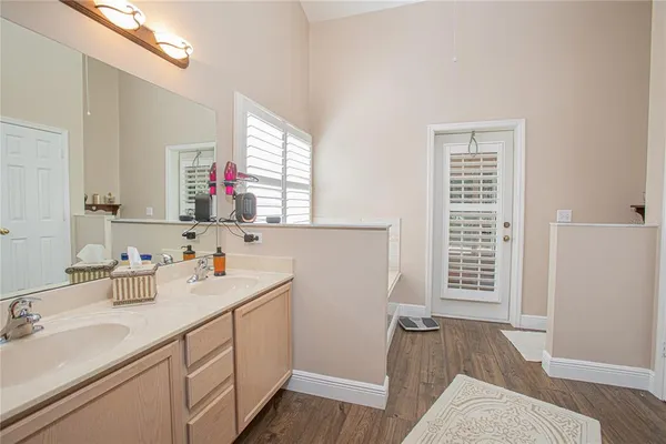 a bathroom with a sink a vanity and a mirror