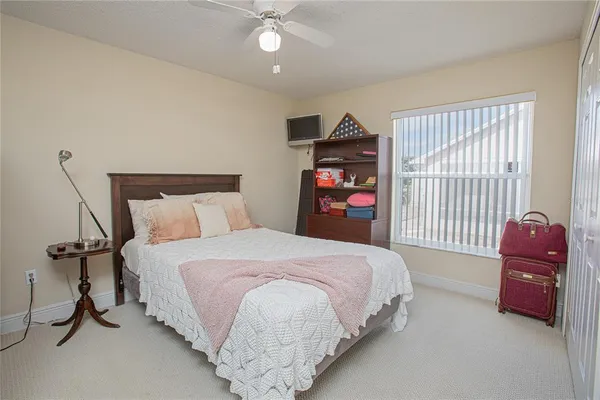 a bedroom with a bed and a closet