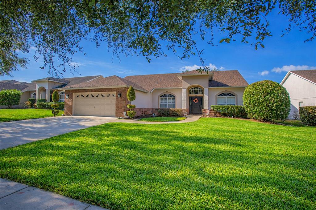 3321 Furlong Way Gotha, FL 34734 - Photo 2 of 26 a front view of a house with a garden