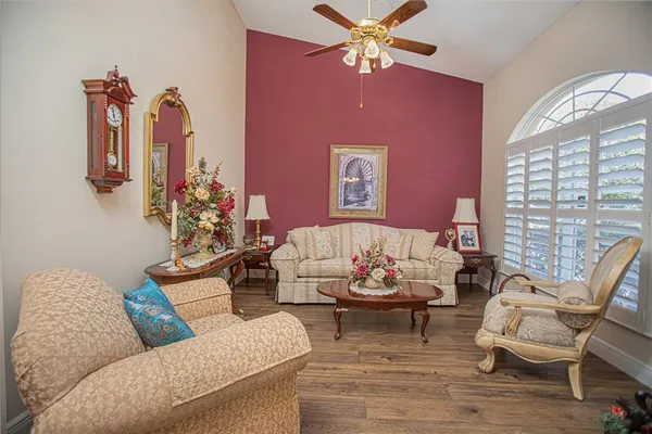a living room with furniture and a large window
