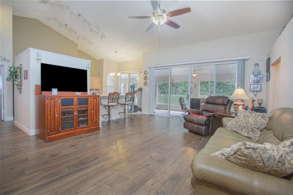 3321 Furlong Way Gotha, FL 34734 - Photo 8 of 26 a living room with furniture and a flat screen tv