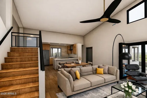 a living room with furniture and wooden floor