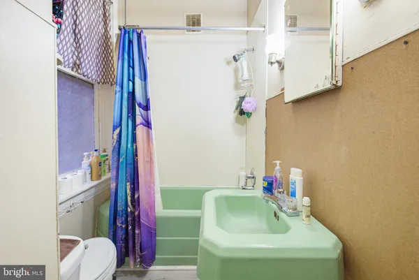 a bathroom with a sink and toilet