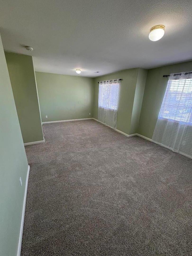 949 Terraza Street Soledad, CA 93960 - Photo 19 of 38 an empty room with windows