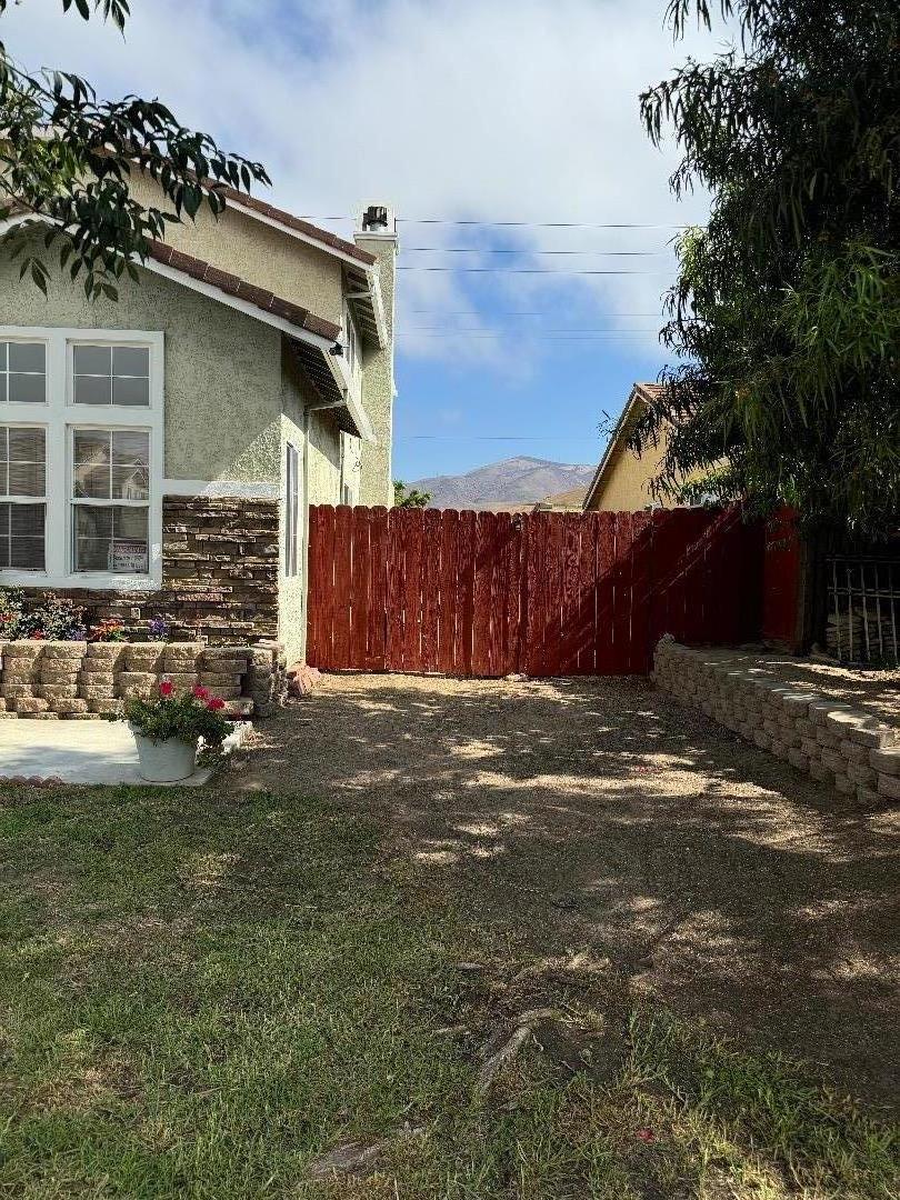 949 Terraza Street Soledad, CA 93960 - Photo 2 of 38 a view of a house with a yard