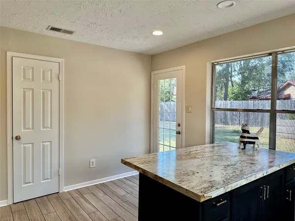 a room with a table and chairs