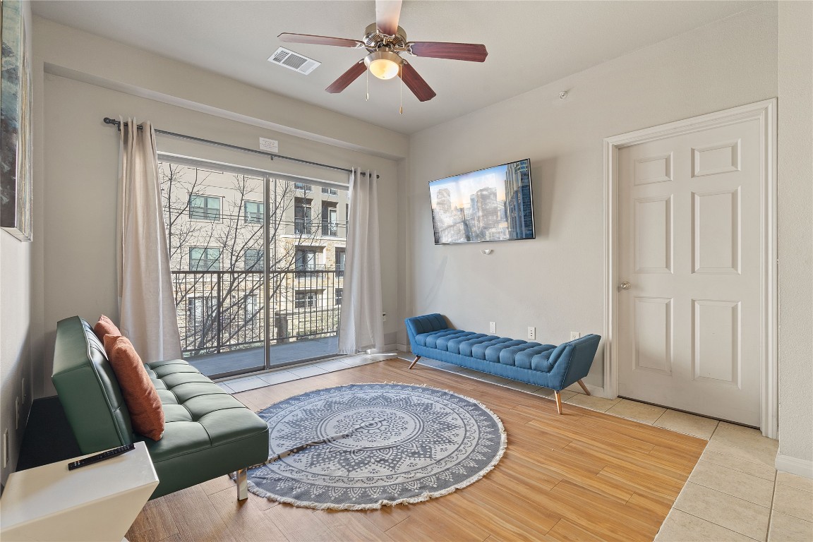 2515 Pearl Street, Unit 314 Austin, TX 78705 - Photo 14 of 17 a living room with furniture and a window