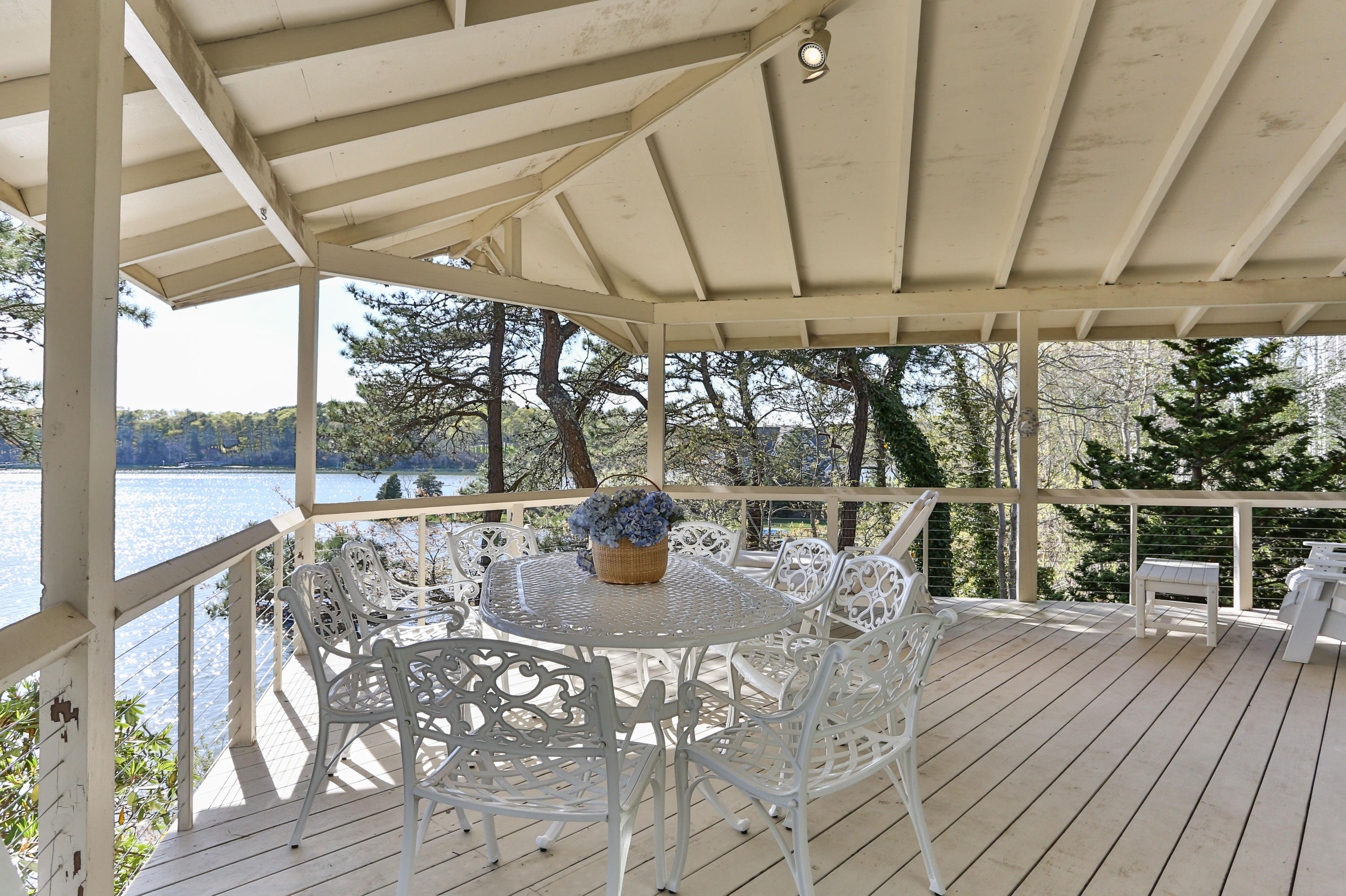 126 Summersea Road Mashpee, MA 02649 - Photo 6 of 31 a view of a porch with furniture and wooden floor