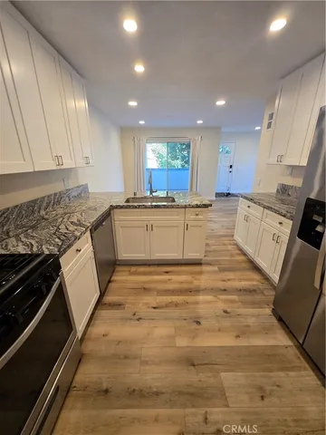 a view of a bathroom with a sink and a mirror