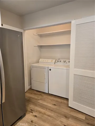 a bathroom with a granite countertop sink toilet a mirror and shower