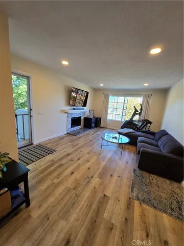 a view of room with furniture and large windows